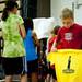 A Dexter Shooting Academy camper receives a t-shirt on Tuesday, July 9. Daniel Brenner I AnnArbor.com
